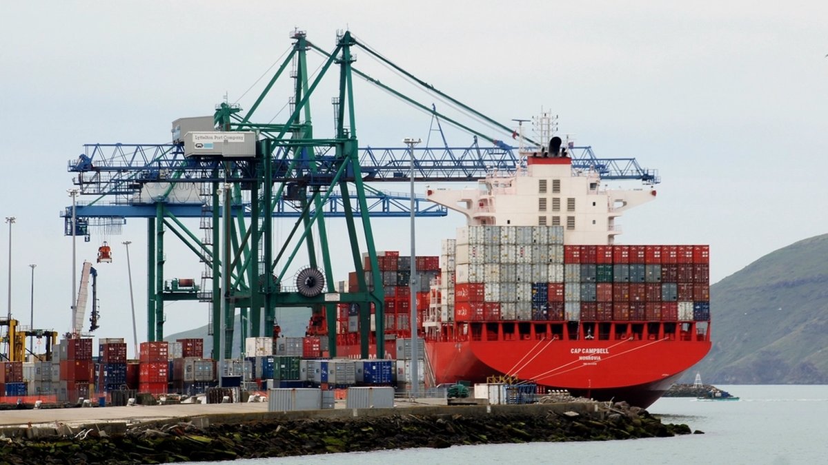 Container ship alongside quay cranes