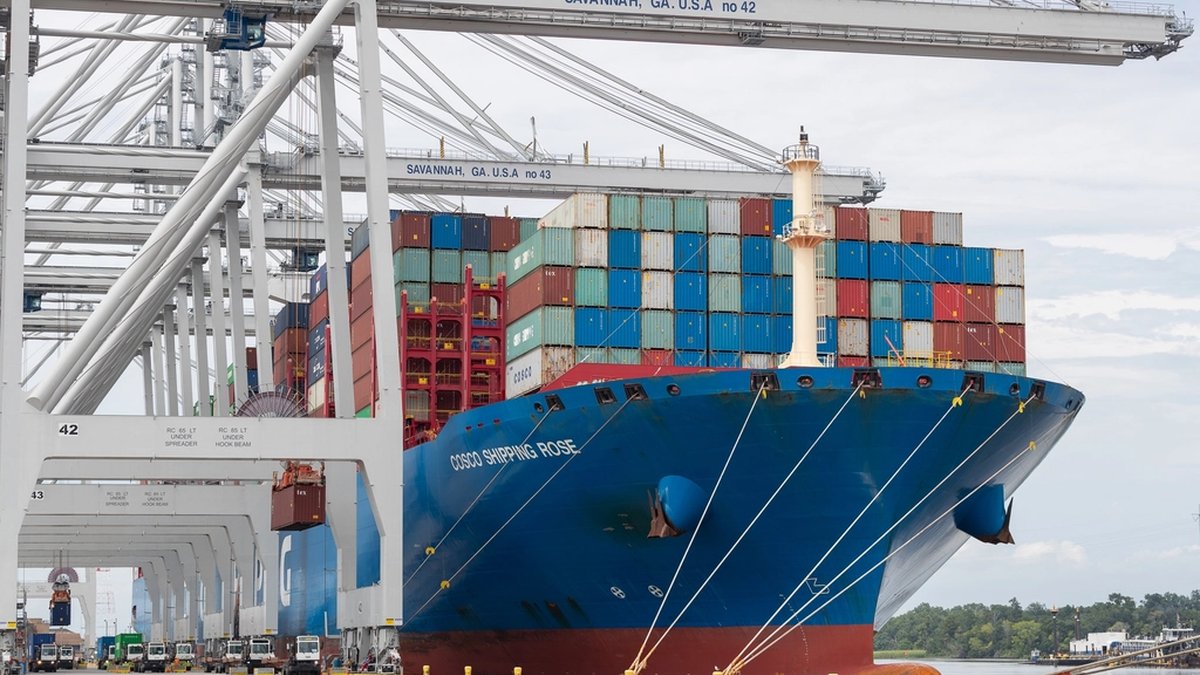 Containers being lifted onto a vessel