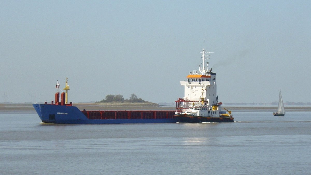 Cargo vessel at anchor off the port